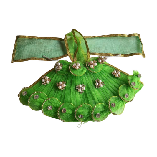 Green decorative headband with pearls and ribbons on a white background