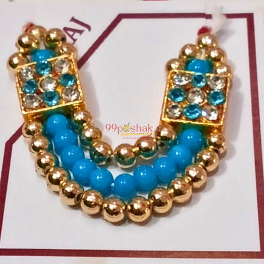 A pair of gold-plated beaded earrings with turquoise blue beads and clear rhinestones, displayed on a white card with a red border.